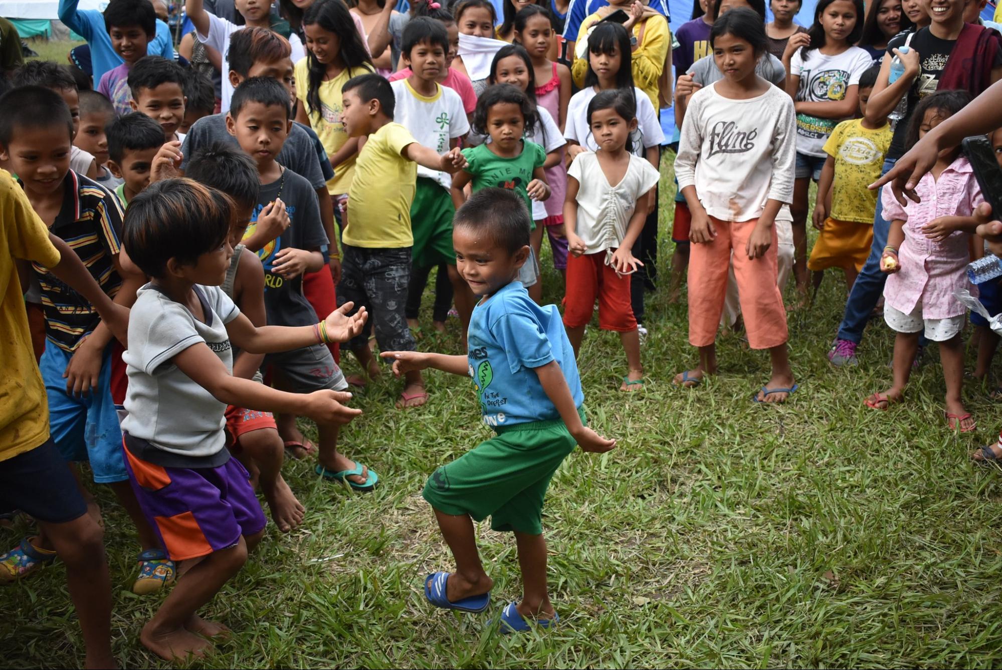 children in cotabato earthquake area dancing