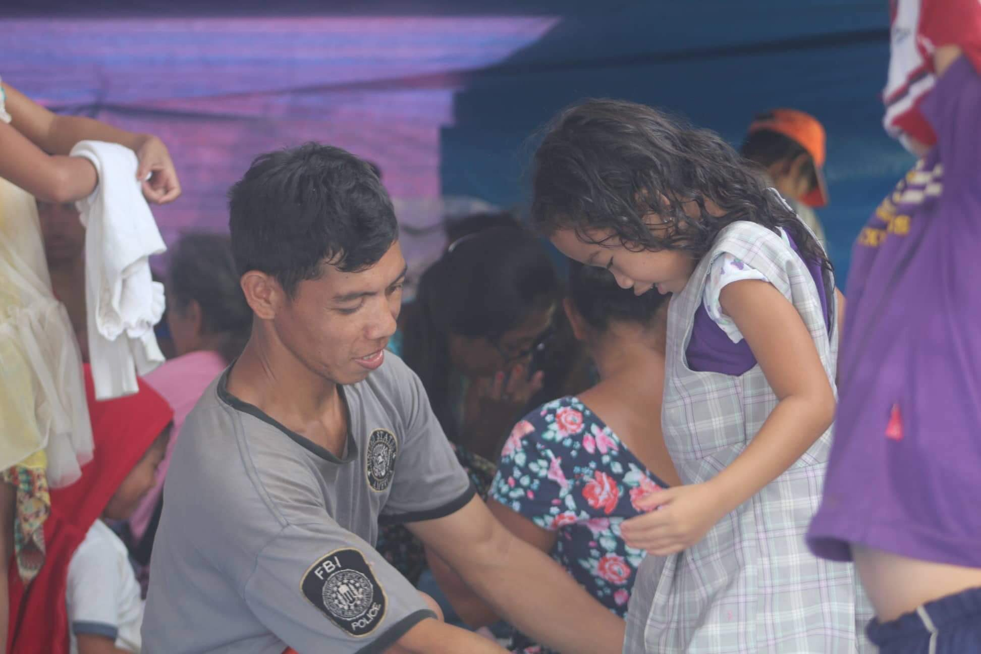 father in kidapawan with daughter trying dress