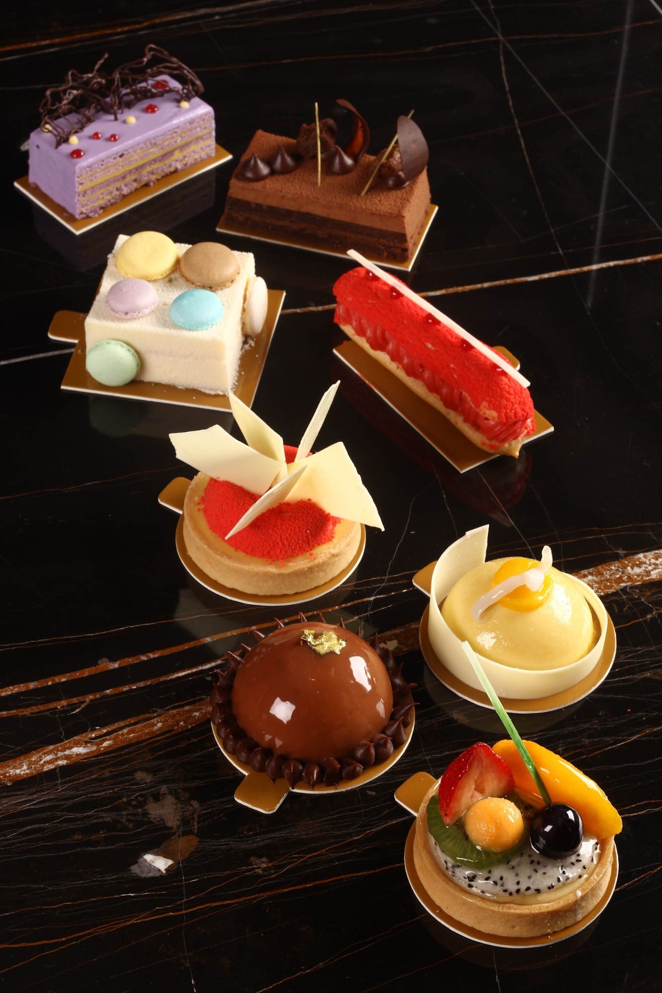 An assortment of intricately-decorated desserts from Solaire Food Court
