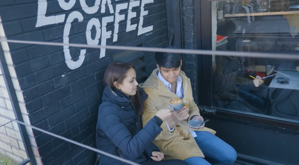 Megan and Mikael in a coffee shop in New York