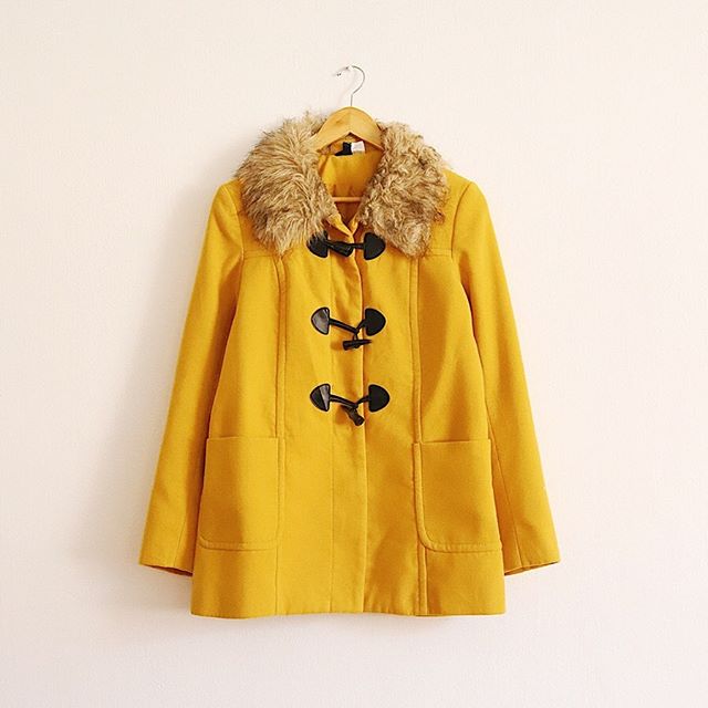 Bright yellow coat from Clarita's Closet