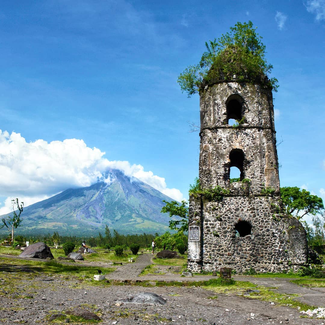 old buildings philippines - Bell Tower of Cagsawa Church guarding Mayon Volcano