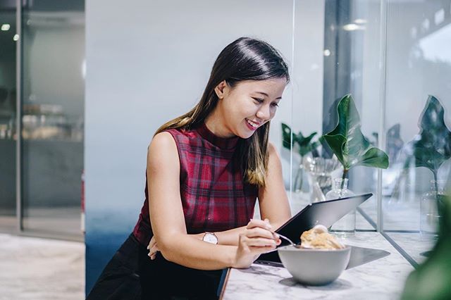 a lady working from home and snacking