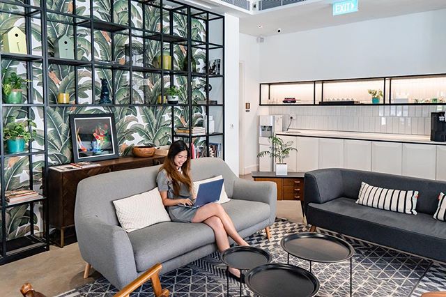 a lady working from home in a nice room