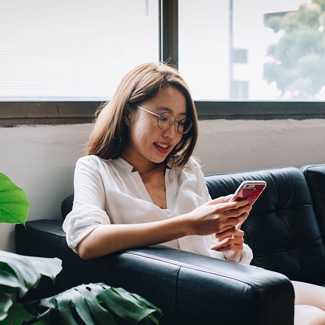 a woman looking at her phone