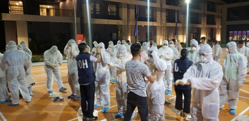 Healthcare workers in the Philippines getting fitted for their Personal Protective Equipment