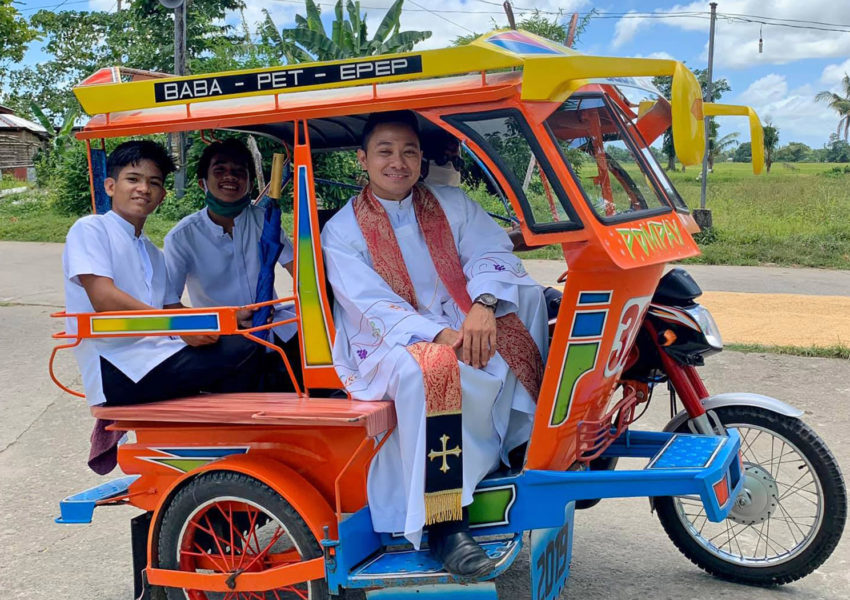 Father Velasquez of Palo, Leyte inside a tricycle 