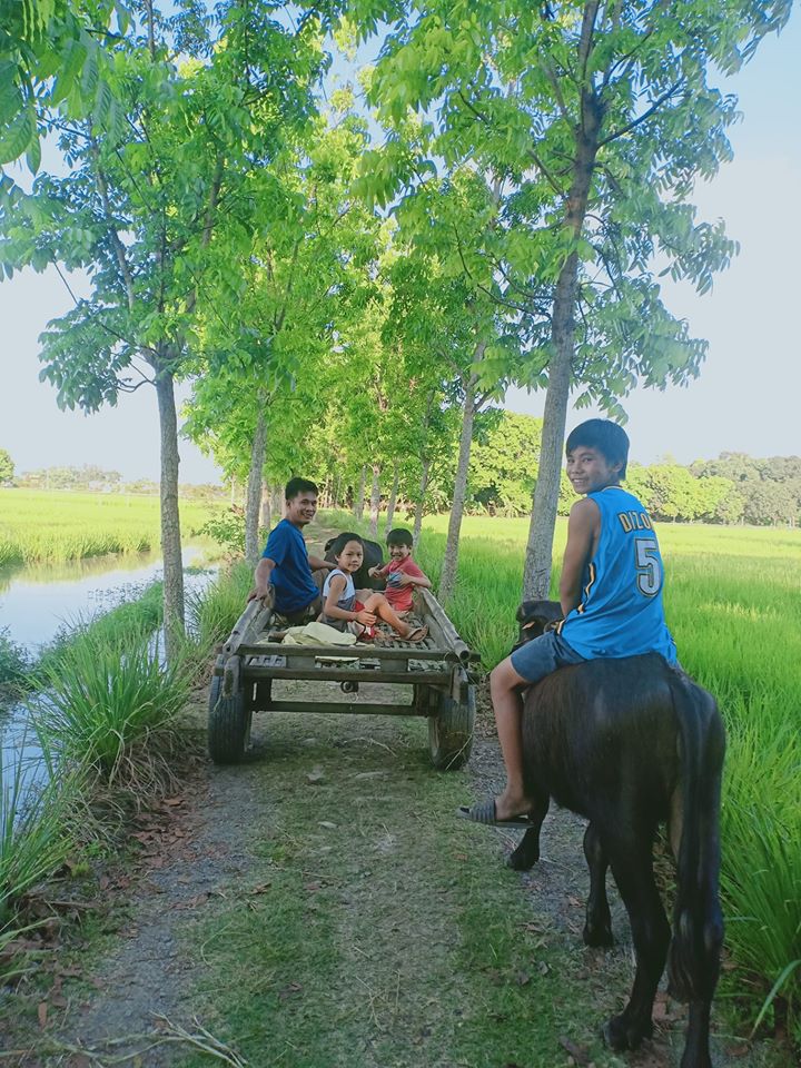 a farmer with his kids in pulilan