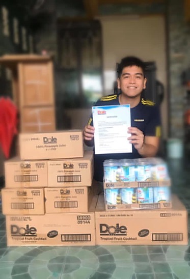 man posing with piles of boxes