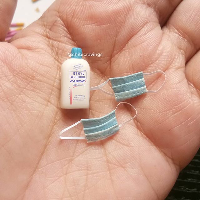 miniature bottles of alcohol and face masks