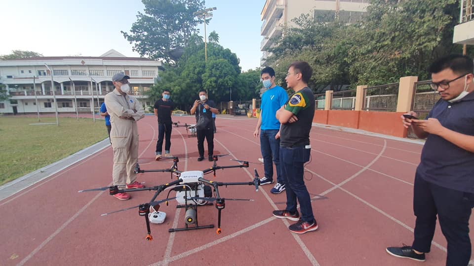 team pilot testing disinfectant drones