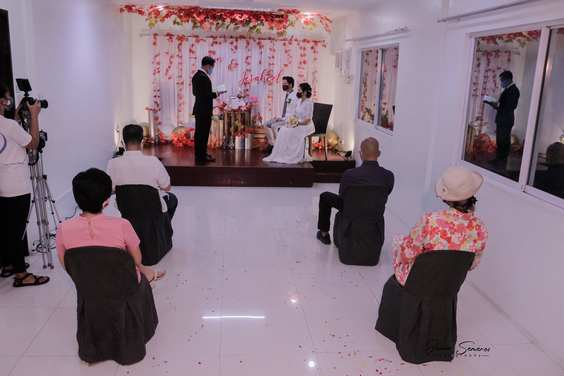 wedding guests seated far apart