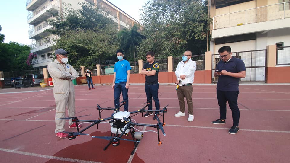men testing a disinfectant drone