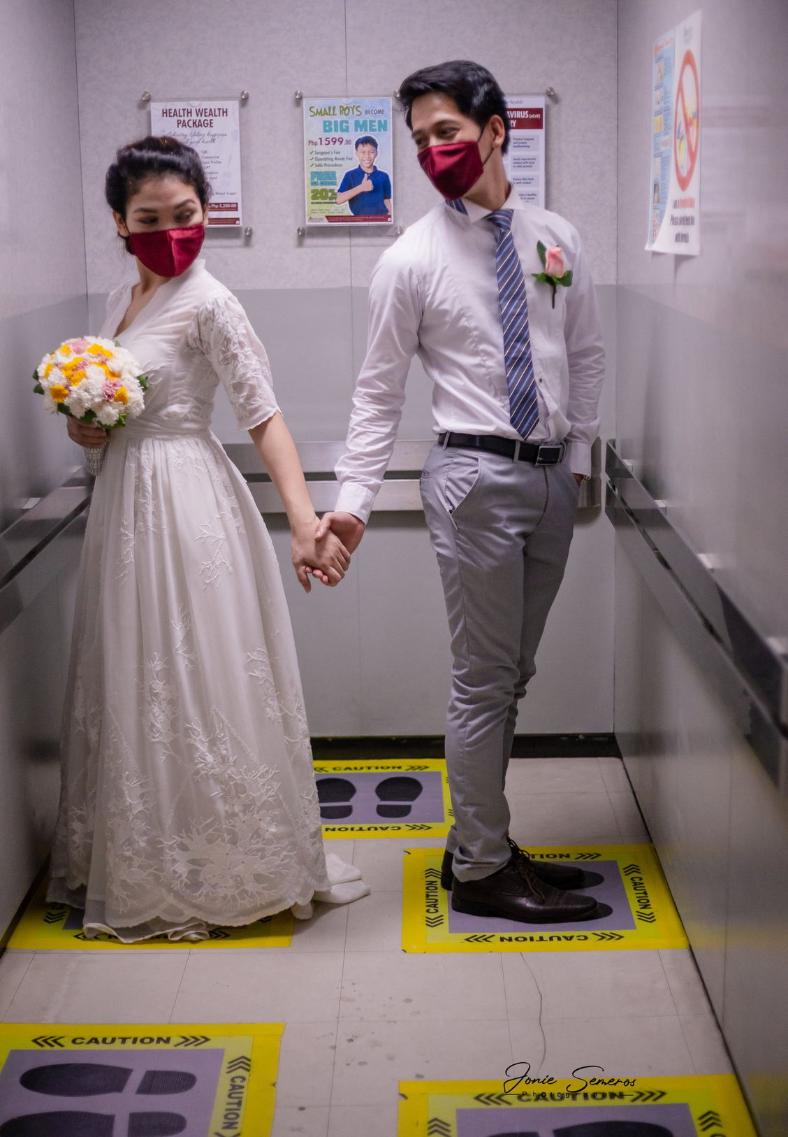 bride and groom wearing face masks