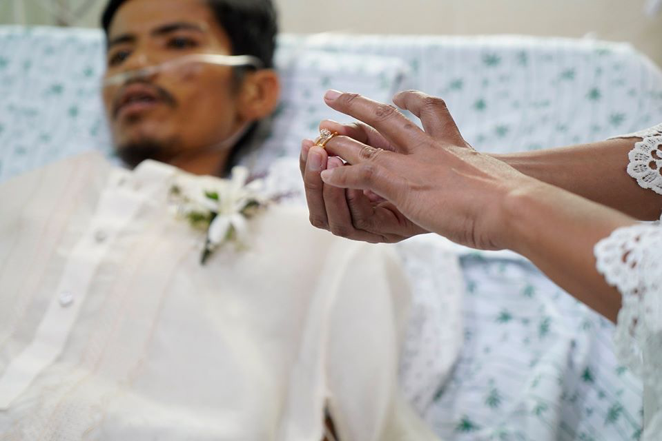 man in hospital bed