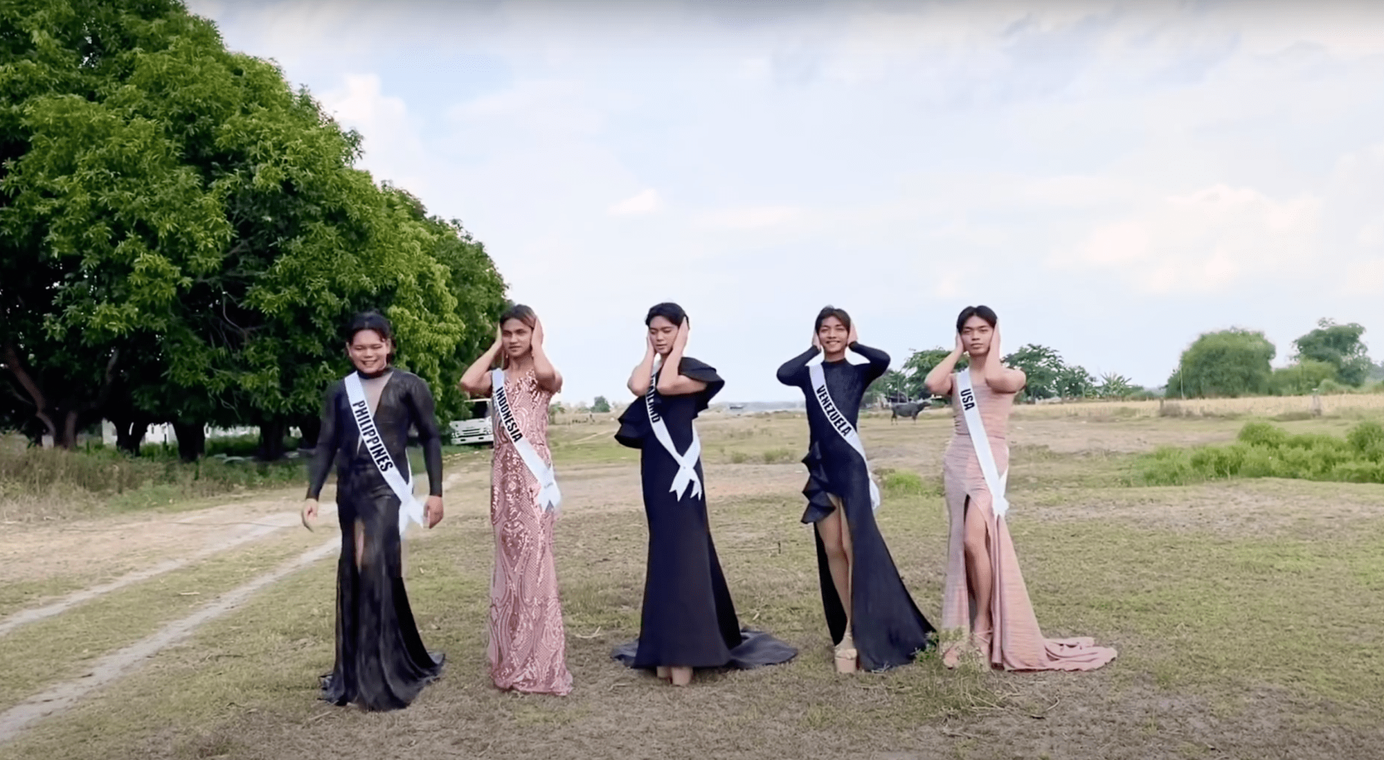 5 Filipinos in evening gowns, 4 covering their ears