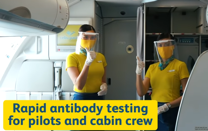 Flight attendants wearing protective gears