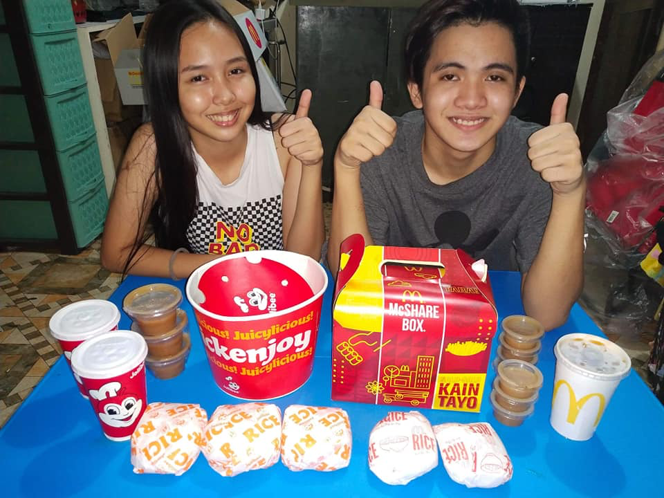 twins with jollibee and mcdo food