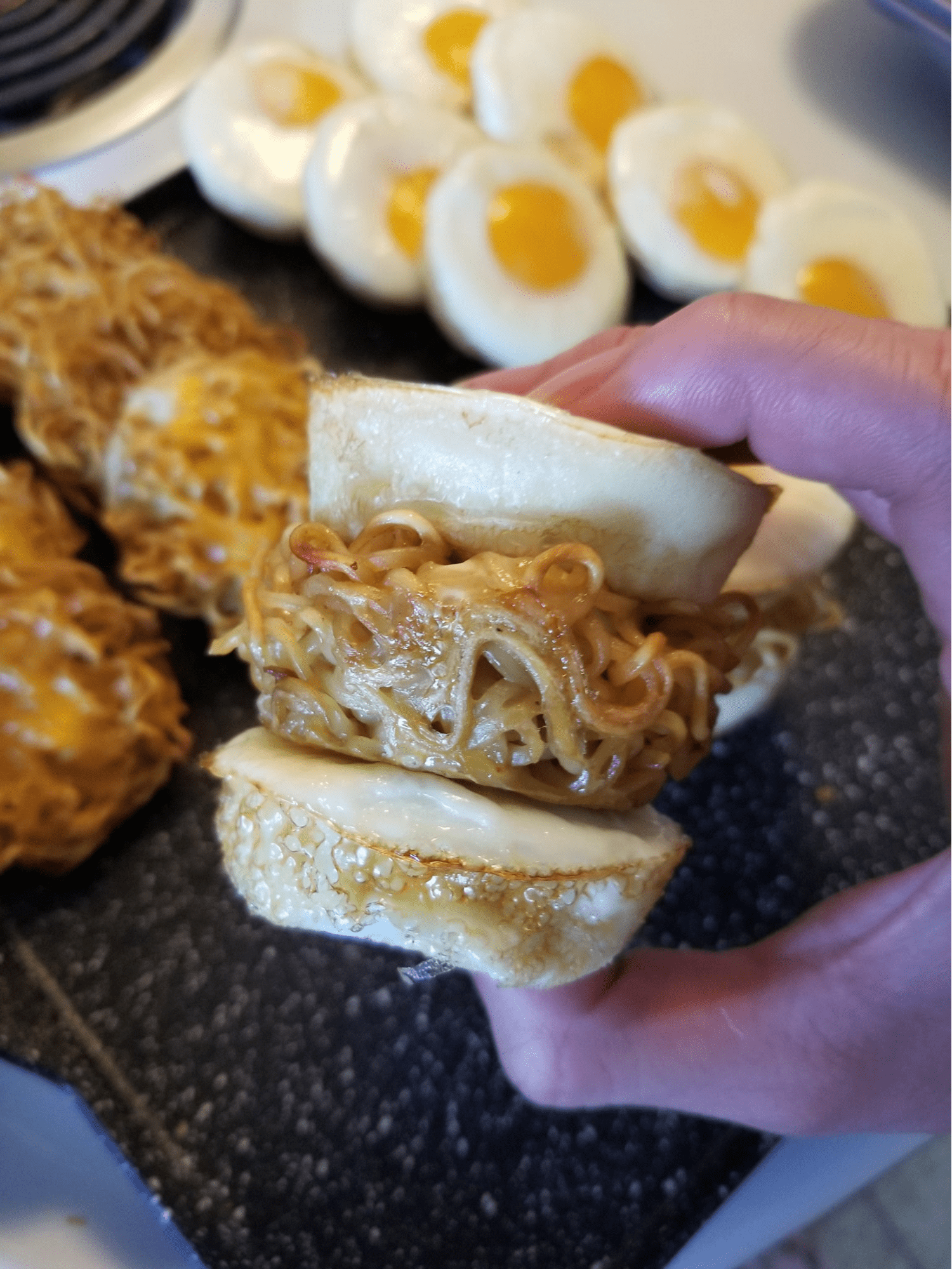 baked noodle cup sandwiched in two eggs