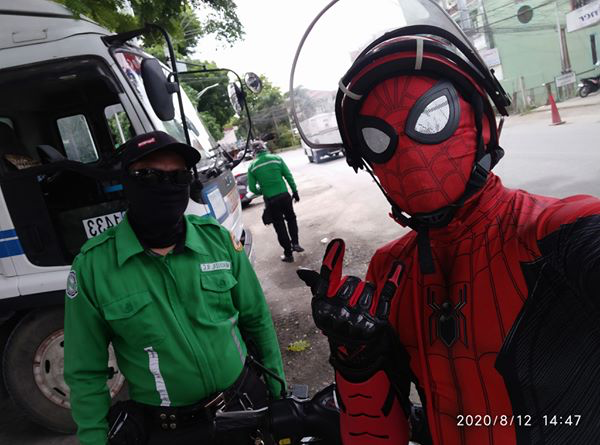 spiderman delivery man - spiderman with traffic enforcer