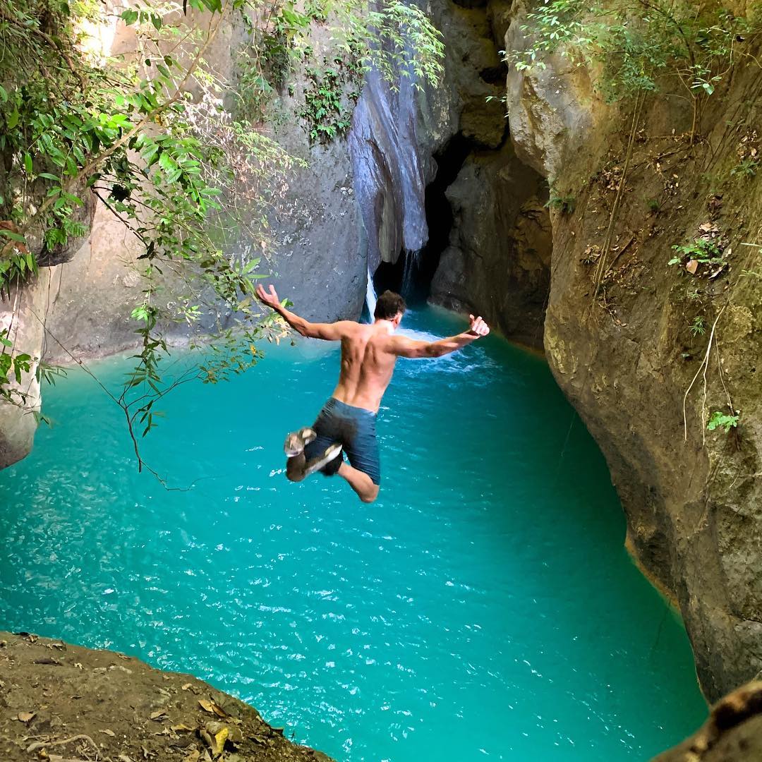 Kabutongan Waterfalls, Cebu - Person cliff diving off the falls
