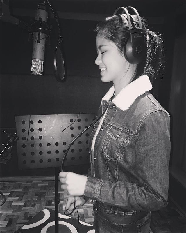 singer recording in a studio